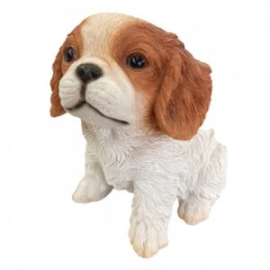 figura decorativa de un cachorro Charliés Spaniel.
